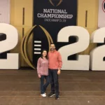 Jay and Hilde smiling at the 2022 Indianapolis National Championship, radiating joy and satisfaction during the event.